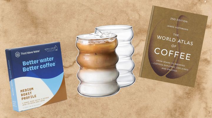 Third Wave Water packets, a set of drinking glasses and "The World Atlas Of Coffee" by James Hoffmann.