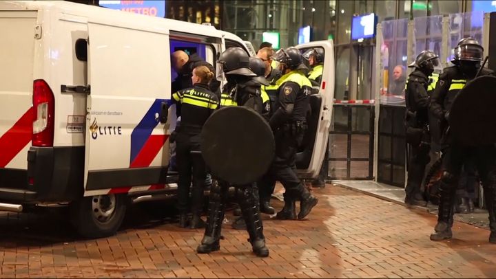 Police detain a man near the Ajax stadium after pro-Palestinian supporters marched despite a ban on pro-Palestinian demonstrations near the soccer stadium, in Amsterdam, the Netherlands.