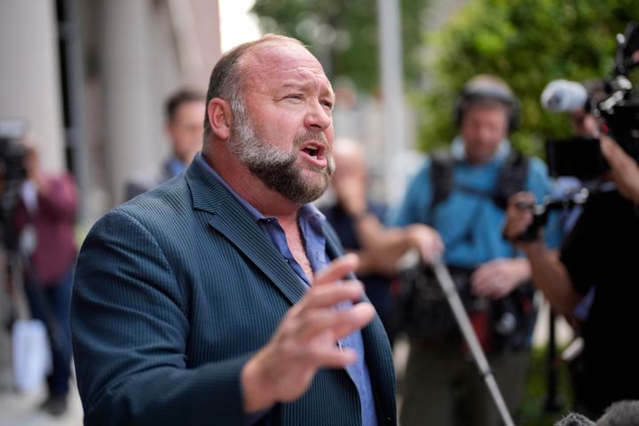 Right-wing conspiracy theorist Alex Jones speaks to the media after arriving at the federal courthouse for a hearing in front of a bankruptcy judge, on June 14, 2024, in Houston. 