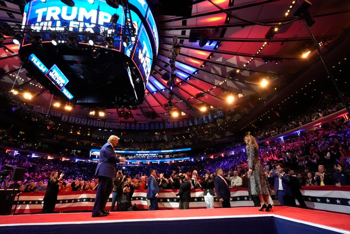 Republican presidential nominee former President Donald Trump and former first lady Melania Trump during at a campaign rally at Madison Square Garden, Sunday, Oct. 27, 2024, in New York. (AP Photo/Alex Brandon)