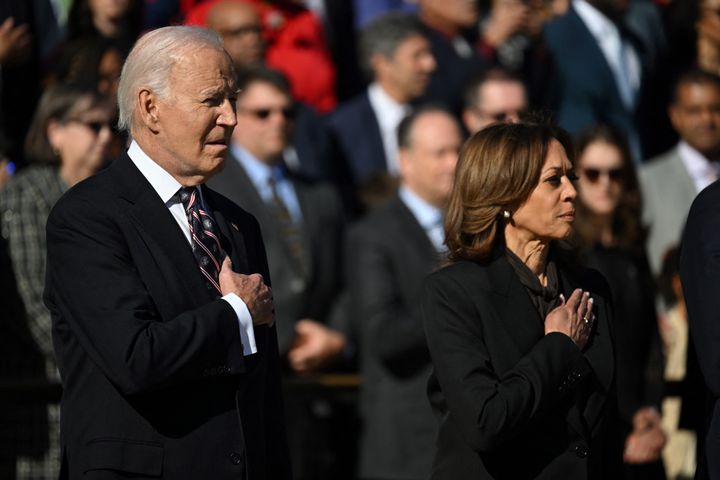 President Joe Biden and Vice President Kamala Harris stand at attention during a wreath-laying ceremony at The Tomb of the Unknown Soldier at Arlington National Cemetery to mark Veterans' Day on November 11, 2024 in Arlington, Virginia. 