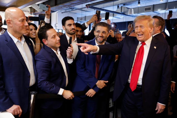 Donald Trump is joined by Amer Ghalib (to his right), the mayor of Hamtramck, Michigan, at The Great Commoner cafe on Nov. 1 in Dearborn, Michigan. 