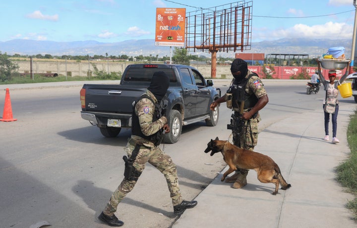 Police officers patrol near the Toussaint Louverture International Airport in Port-au-Prince, Haiti, Tuesday, Nov. 12, 2024. (AP Photo/Odelyn Joseph)