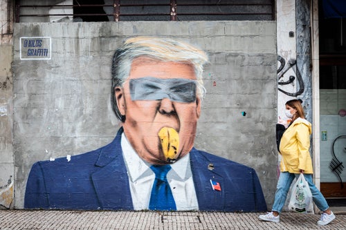 Graffiti by the Portuguese artist Kilos depicts Donald Trump with a banana in his mouth.