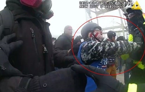 Lee Stutts of North Carolina is shown allegedly shoving a police officer at the Capitol on Jan. 6, 2021.