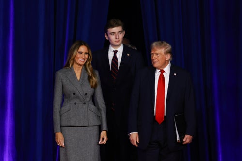 Donald Trump arrives to speak with former first lady Melania Trump and their son, Barron Trump, during an election night event at the Palm Beach Convention Center.