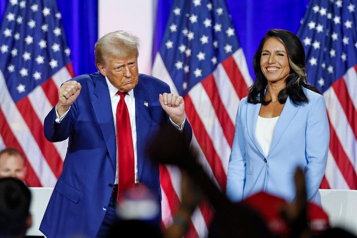 Then-Republican presidential candidate Donald Trump dances as he leaves the stage in August after speaking alongside former Rep. Tulsi Gabbard during a town hall meeting in La Crosse, Wisconsin.