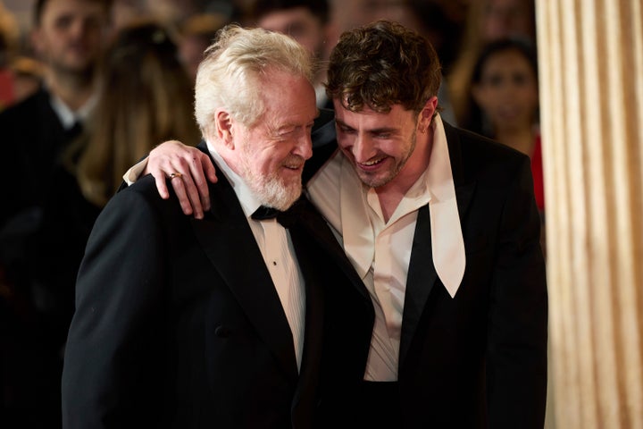 Ridley Scott and Paul Mescal share a laugh at the premiere of their new film