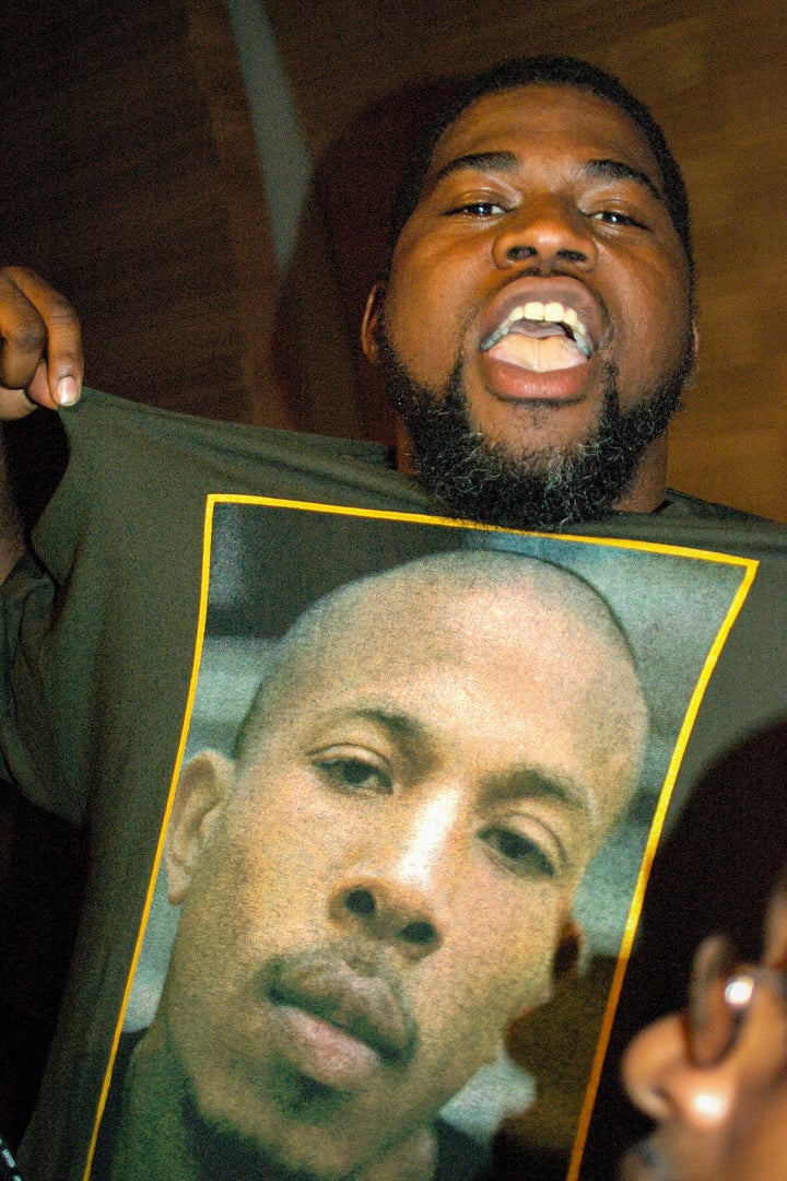 Rapper David Banner (born Lavell Crump) wears a T-shirt in support of then-incarcerated rapper Shyne (born Jamal Barrow) on Aug. 9, 2004, in New York City.