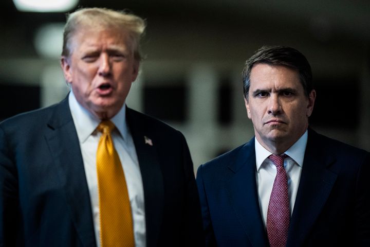 Former President Donald Trump speaks to reporters with his attorney Todd Blanche, right, as jurors begin deliberations for his trial at Manhattan criminal court, Wednesday, May 29, 2024, in New York.