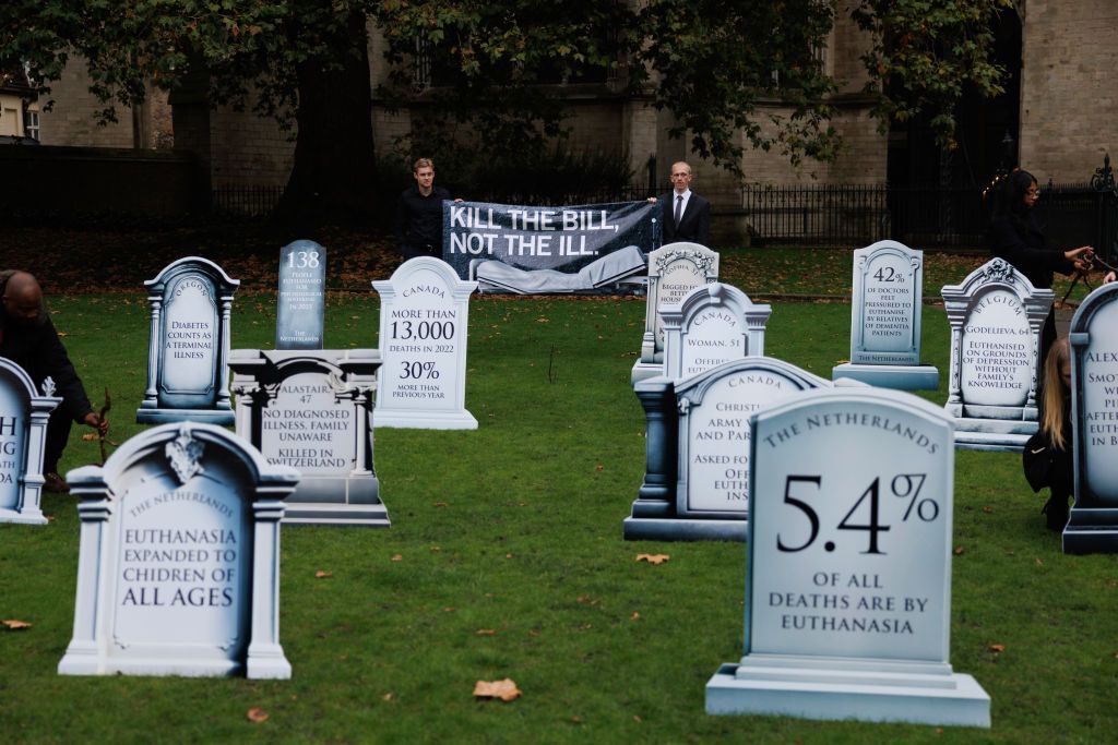 Campaigners near Parliament Square against the proposed bill to legalise assisted dying.