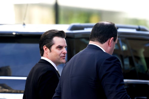 Former Rep. Matt Gaetz (R-Fla.), left, and Boris Epshteyn, an adviser to President-elect Donald Trump, arrive for a House Republican conference meeting Wednesday in Washington.