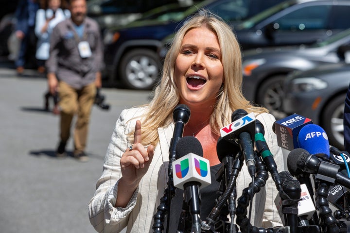 Karoline Leavitt, former President Donald Trump's campaign press secretary, speaks to the news media across the street from Trump's criminal trial in New York, Tuesday, May 28, 2024.
