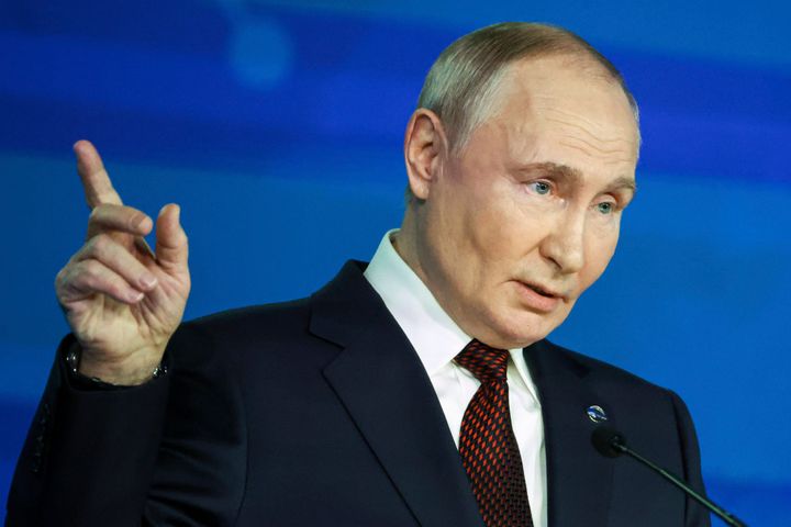 Russian President Vladimir Putin points during a meeting with foreign policy experts at the Valdai Discussion Club in the Black Sea resort of Sochi, Russia, Thursday, Nov. 7, 2024.