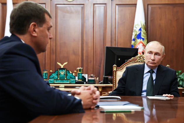 Russian President Vladimir Putin, right, listens to the Moscow-appointed head of the Russian-controlled Zaporizhzhia region of Ukraine, Yevgeny Balitsky, during a meeting at the Kremlin.