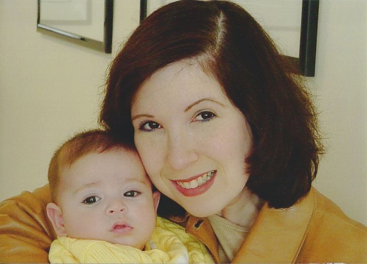 The author poses with her baby prior to her firing. "I expected an apology — or at least an explanation — for my abrupt dismissal, but never got one," she writes.