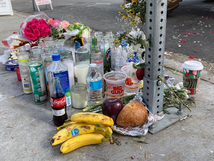 Offerings of food and beverages surround flowers and candles at the makeshift memorial where Rachael Martinez and Jose Medina were killed in San Diego on Nov. 13.