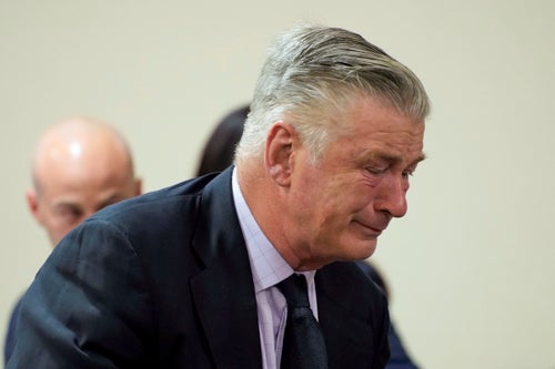 Actor Alec Baldwin reacts to his involuntary manslaughter charge being thrown out in July.