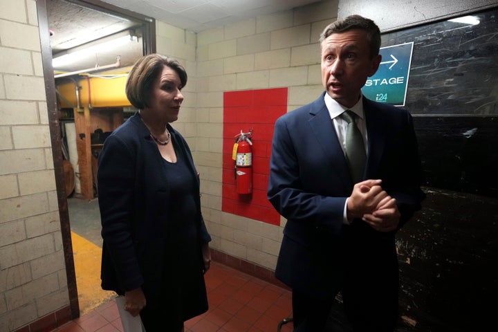 Martin confers with Sen. Amy Klobuchar (D-Minn.) on election night in St. Paul. No Democrat has lost a bid for statewide office on his watch — far from a given in prior years.