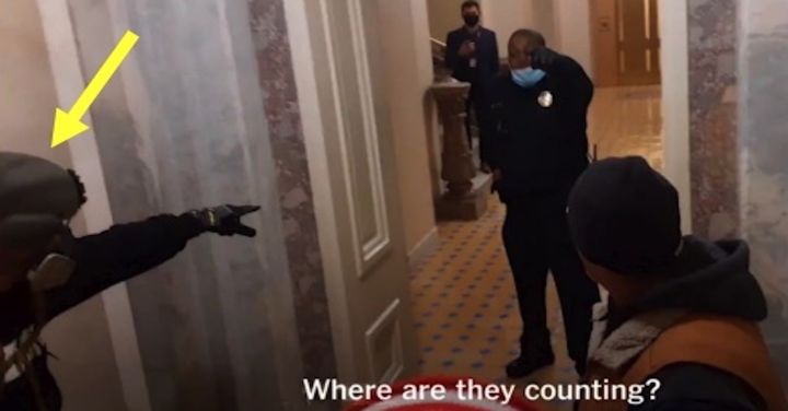 Jan. 6 rioter Edward Kelley, indicated in a court exhibit by a yellow arrow, confronts U.S. Capitol Police Officer Eugene Goodman inside the Capitol on Jan. 6, 2021.