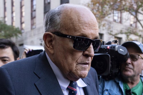 Former New York City Mayor Rudy Giuliani arrives at the court to explain to a federal judge why he hasn't surrendered his valuables as part of a $148 million defamation judgment, in New York, Thursday, Nov. 7, 2024. (AP Photo/Yuki Iwamura)