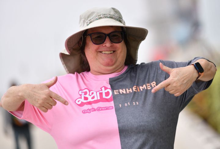 An attendee points at her "Barbenheimer" shirt outside the convention center during Comic-Con International in San Diego, California, on July 20, 2023.