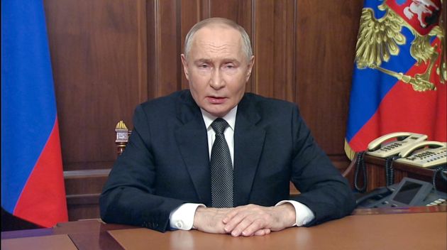 Vladimir Putin addressees the nation at the Kremlin in Moscow.