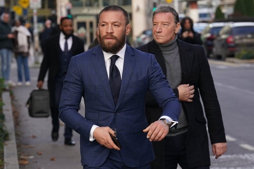 Mixed martial arts fighter Conor McGregor with his father Tony, outside the High Court in Dublin, where he is appearing for a personal injury case against him. (Photo by Brian Lawless/PA Images via Getty Images)