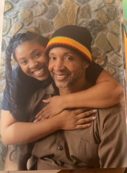 The author poses with her father as a child. "Even everyday life felt incomplete without him," she writes.