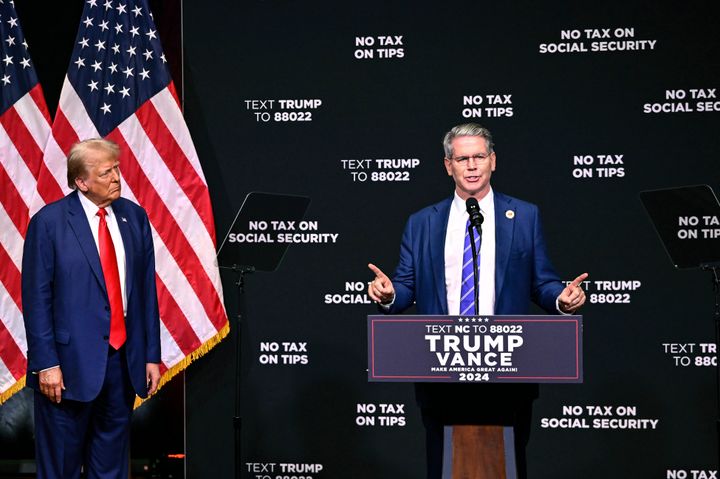 Donald Trump, left, listens as investor Scott Bessent speaks on the economy in Asheville, N.C., Wednesday, Aug. 14, 2024.