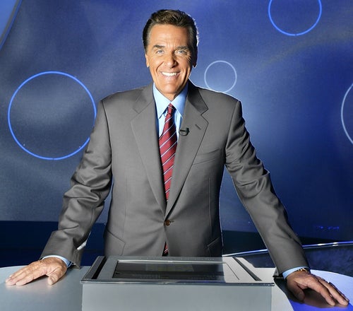 LOS ANGELES, CA - OCTOBER 22: Host of the Game Show Network Show, Lingo Chuck Woolery poses on the set October 22, 2003 in Los Angeles California. (Photo by Carlo Allegri/Getty Images for the Game Show Network)