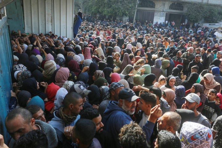 Hundreds of Palestinians gather to buy bread from the area's only bakery in Deir al-Balah, Gaza on Nov. 22, 2024. Palestinians are starving due to Israel's attacks on Gaza for more than a year, the closure of border crossings and the extremely limited access to aid.