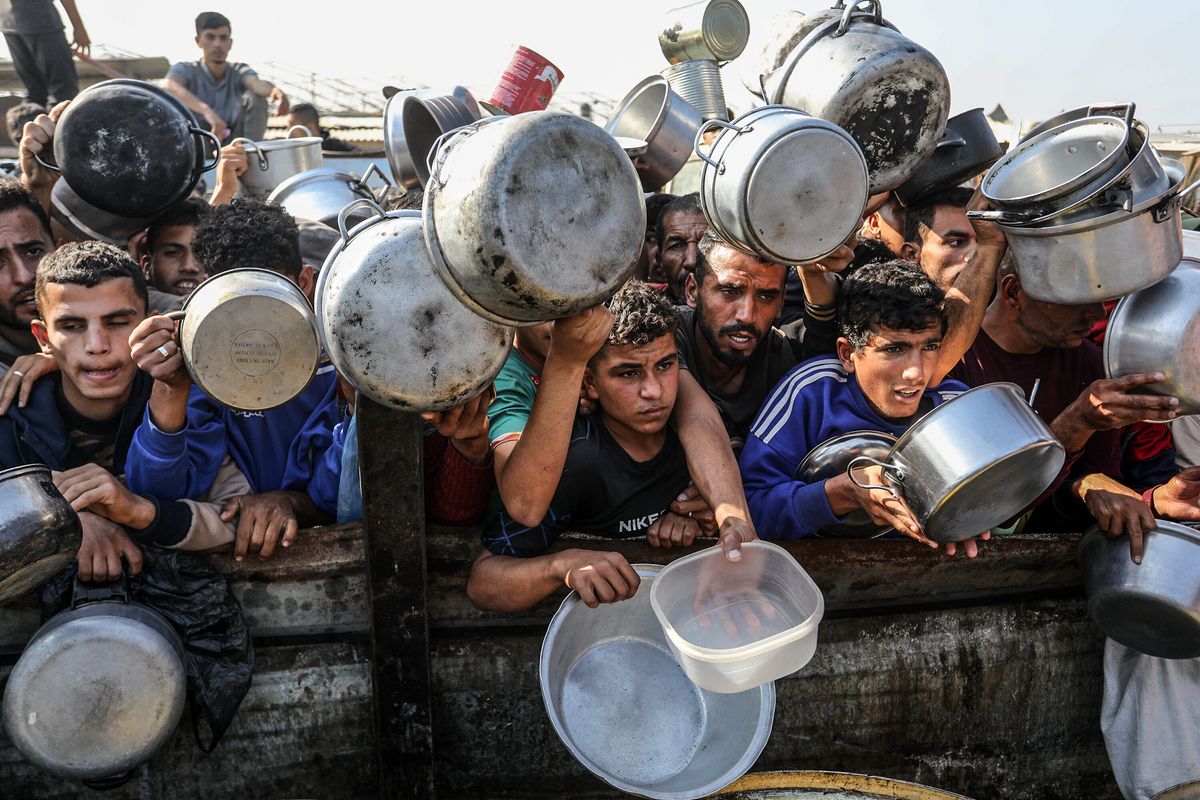 Palestinians flock to food distribution Gaza's Khan Yunis amidst Israeli attacks