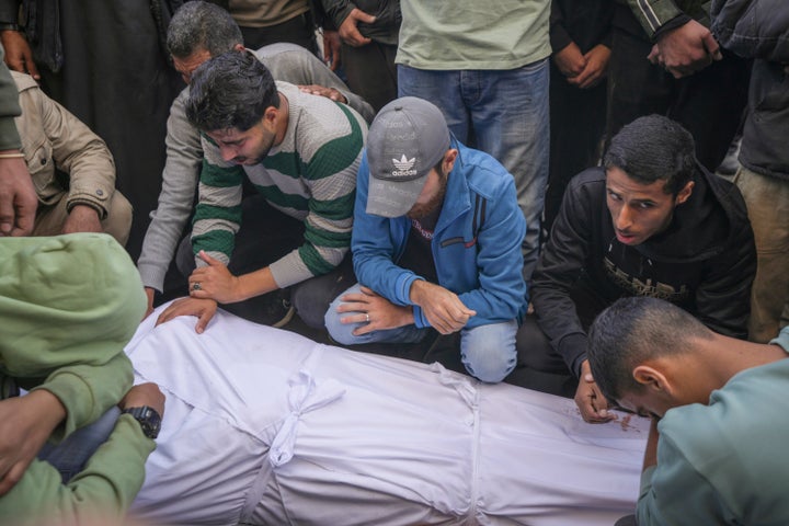 Men mourn over the bodies of victims from an Israeli airstrike outside a hospital in Deir al-Balah, Gaza, on Nov. 17.