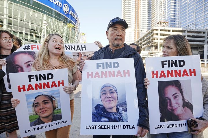 Ryan Kobayashi, center, holds a picture of his missing daughter Hannah Kobayashi in Los Angeles on Thursday, Nov. 21.