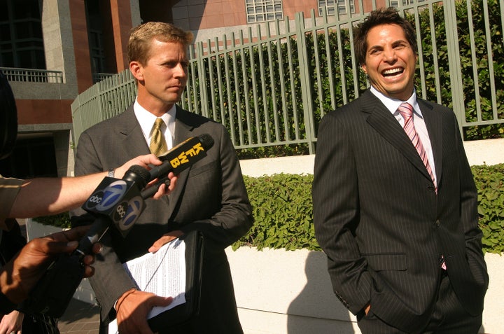 Girls Gone Wild founder Joe Francis talks to the media with his attorney Aaron Dyer outside the Edward R. Roybal Federal Building in Downtown Los Angeles on Sept. 25, 2006, after pleading guilty to two felonies of violating federal record-keeping and labeling laws meant to protect minors from sexual exploitation.