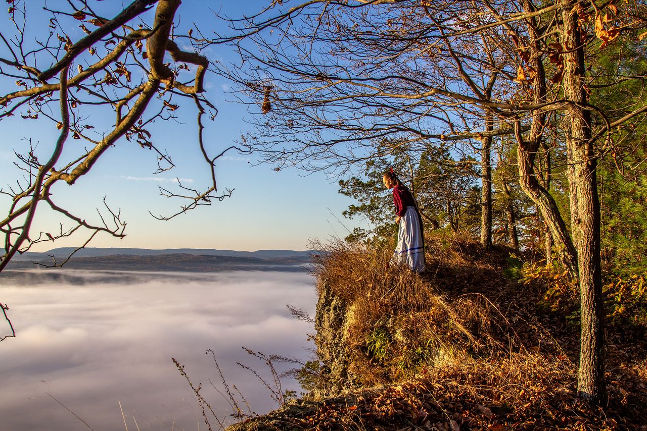 River Whittle gazes into morning fog blanketing the Delaware River Valley in the Delaware Water Gap National Recreation after a sunrise ceremony during her first visit to her Lenape homelands in 2019. All of the sovereign nations of the Lenape people were driven out of Lenapehoking (their homeland — which includes Southeast New York, all of New Jersey, Eastern Pennsylvania, and parts of Delaware and Maryland), by plagues, war, exploitative treaties and scalp bounties. Whittle is part of a growing movement known as “landback”, which seeks to support the return of massive swaths of land, including public lands, to Indigenous tenureship. Landback activists believe returning public and other lands to Indigenous People would serve not only as long overdue reparations for the illegal violation of every Indian treaty the U.S. ever signed, but as a way to better combat climate change and ecological devastation.