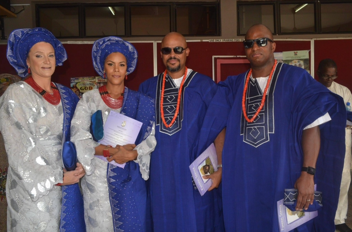 From left: Catherine (the author's sister-in-law), the author, Femi (the author's brother) and Mike (the author's husband) at Archbishop Vining Church, Ikeja Lagos, in May 2016). The funeral celebrants are dressed in royal blue ceremonial aso oke, complete with ileke, coral necklaces traditionally worn at times of celebration.