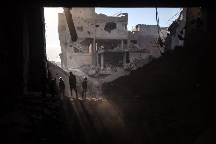 Palestinian children inspect the damage at the site of an Israeli airstrike in central Gaza's Nuseirat camp on Nov. 27, 2024.