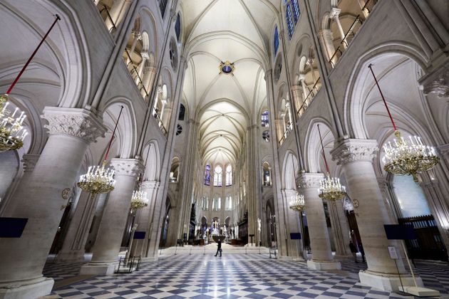 The nave of Notre Dame Cathedral is seen while French President Emmanuel Macron visits the restored interiors of the building Friday in Paris.