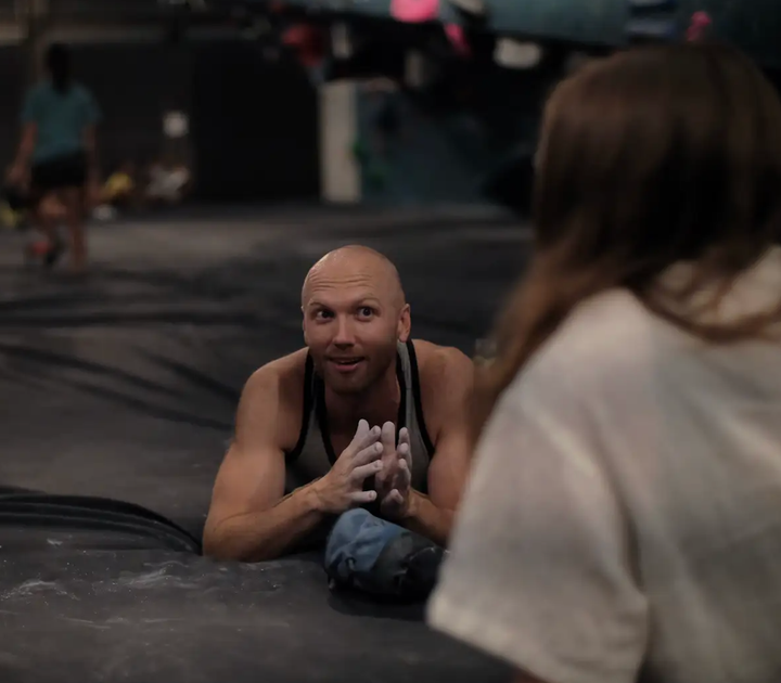 The author and his friends enjoy an off-the-phone conversation at a climbing gym.