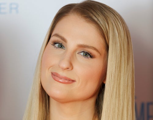 Meghan Trainor says she can no longer smile properly after a "lip flip" procedure gone wrong.