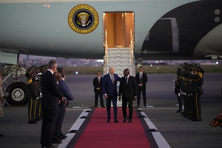 President Joe Biden is greeted by Angolan Foreign Minister Tete Antonio as he arrives at Quatro de Fevereiro international airport in the capital Luanda, Angola on Monday, Dec. 2, 2024, on his long-promised visit to Africa.