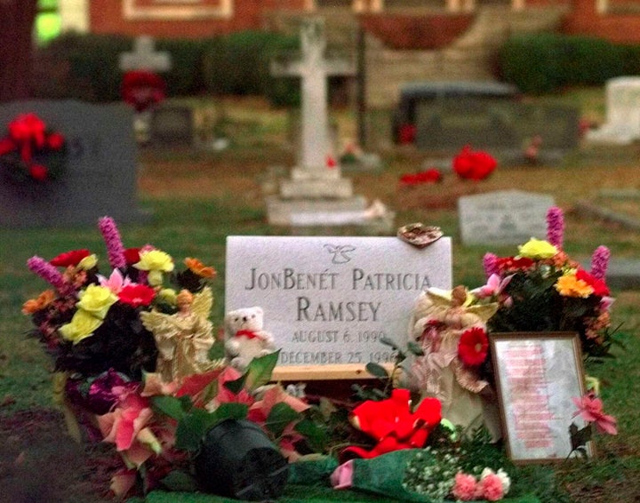 Flowers, pictures and stuffed animals adorn the gravesite of JonBenét Patricia Ramsey on Dec. 26, 1997, at the St. James Episcopal Church Cemetery in Marietta, Georgia.