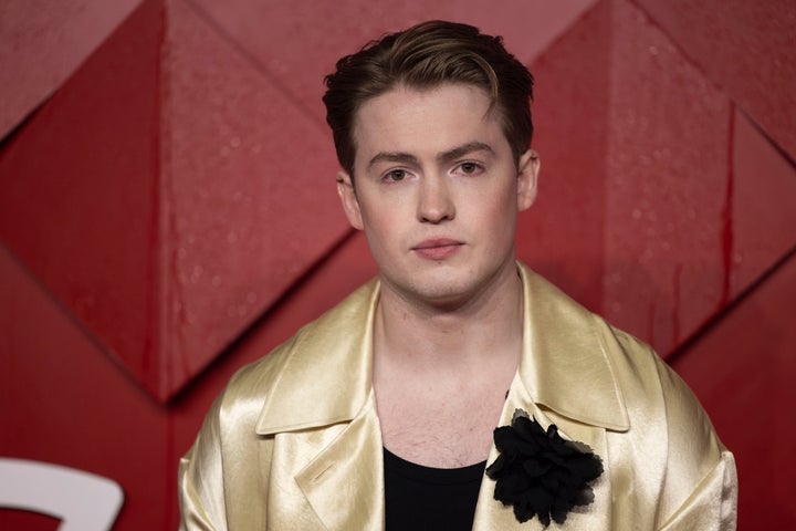 Kit Connor poses for photographers upon arrival at the British Fashion Awards on Monday, Dec. 4, 2023 in London. (Vianney Le Caer/Invision/AP)