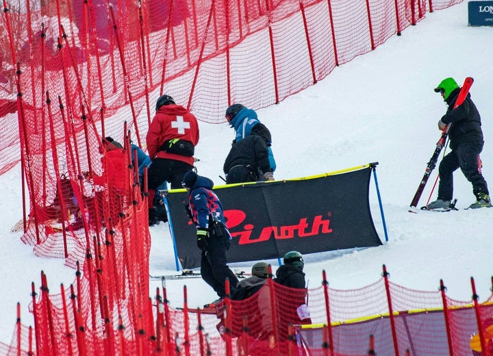 Shiffrin, seen here on the ground, shrouded by safety netting and surrounded by medics.