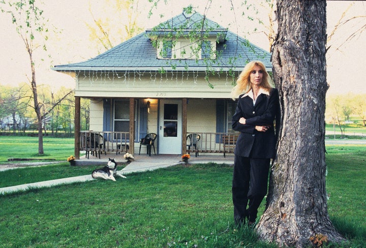 Eminem's mother, Debbie Nelson, poses outside her house in September 2005 in Detroit.