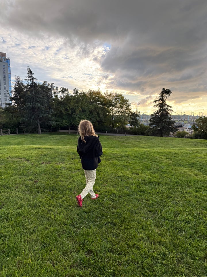 The author's nonbinary child at sunset.