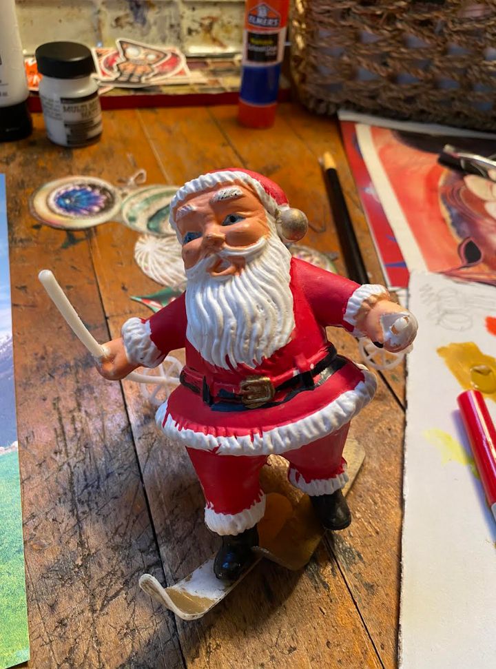 "Santa attempting to ski on the wooden work table in my studio. It's dicey," the author writes.