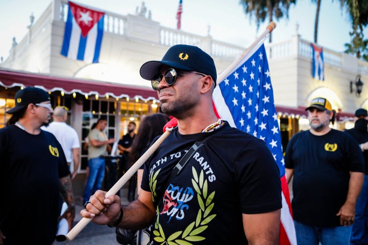 Henry "Enrique" Tarrio, leader of The Proud Boys, holds a U.S. flag during a protest showing support for Cubans demonstrating against their government, in Miami, Florida, on July 16, 2021.